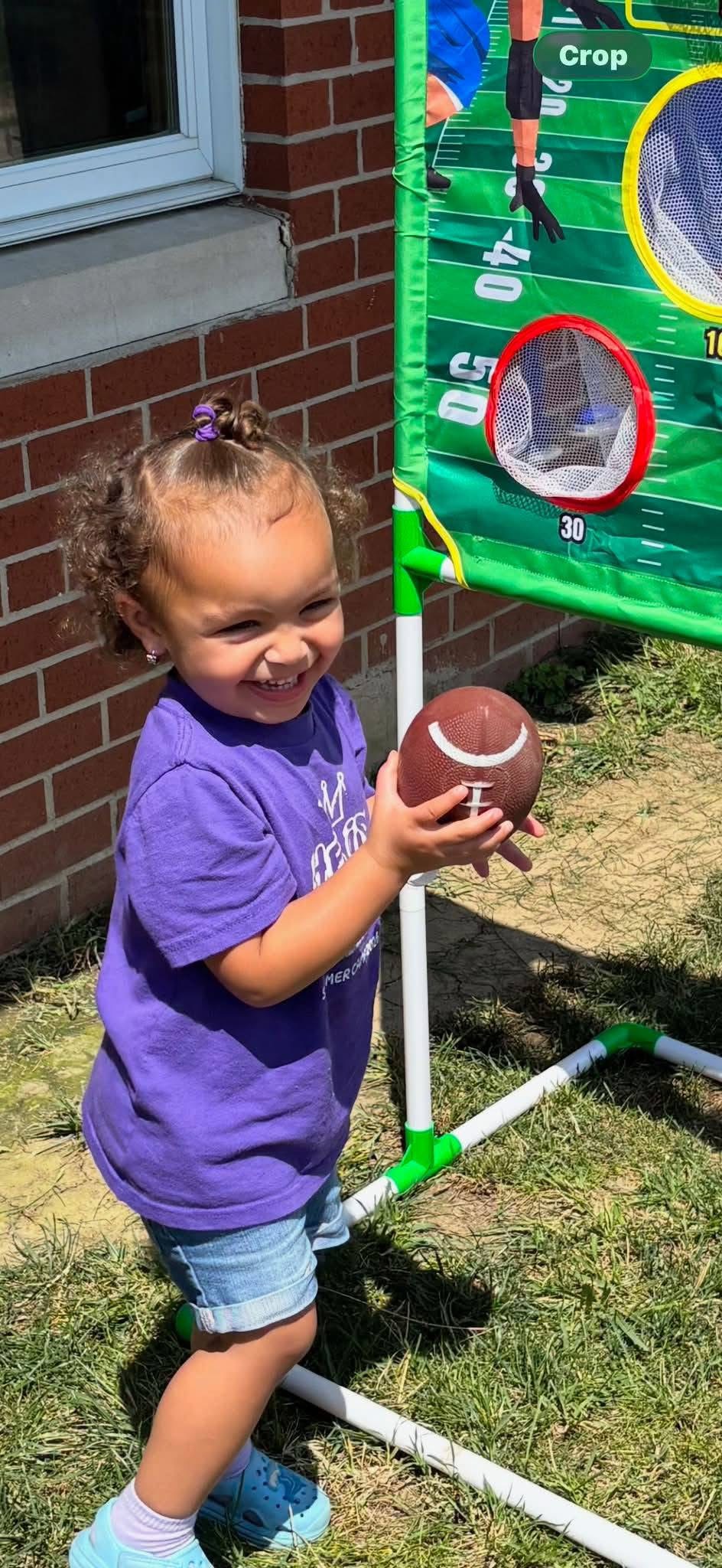 A preschool child practicing coordination during outdoor play
